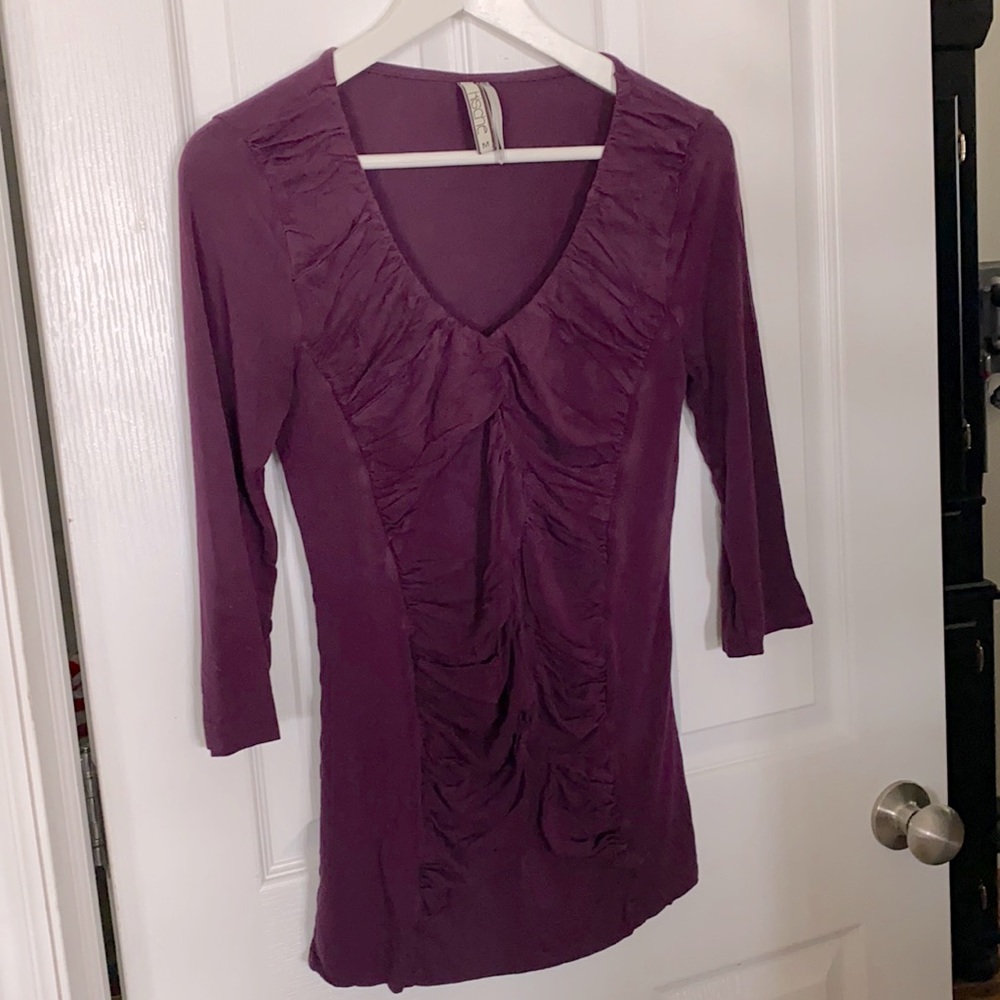 Plum color v neck shirt. Ruched on the front.